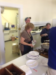 Judy manning the turkey and Rick overseeing! 